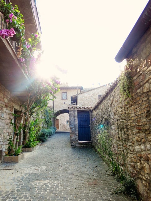 Assisi, Italy, narrow street, cobble stone road and stone walls