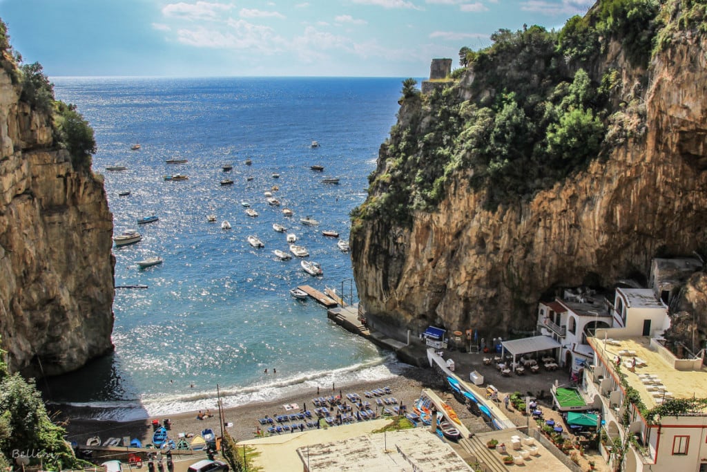 Amalfi Coast Praiano, Italy, view from above, bech down the bottow, buidings, boats, cliffs on each side of the beach
