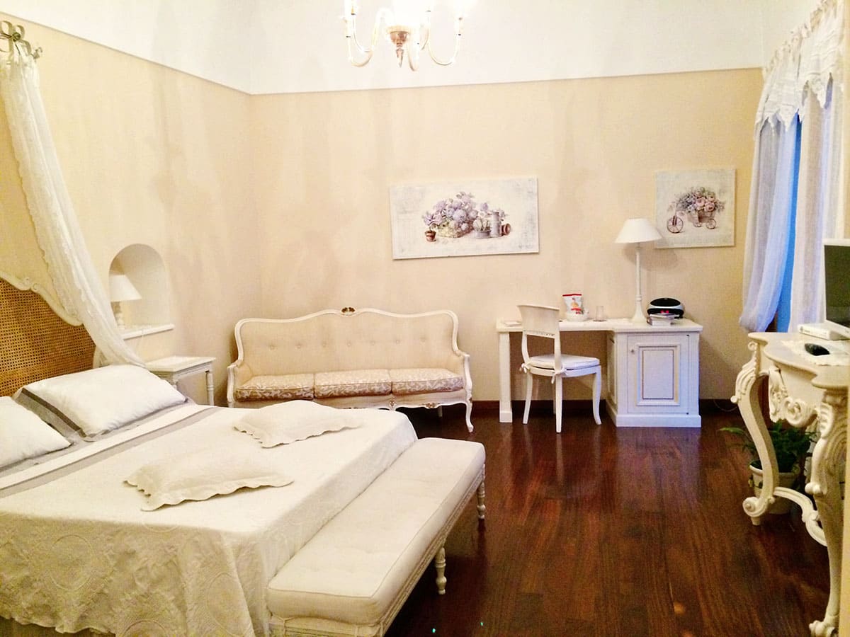 Accommodation in Positano, Amalfi Coast, Italy, Villa Mary Positano, white and cream decor, bed, lounge desk, chair
