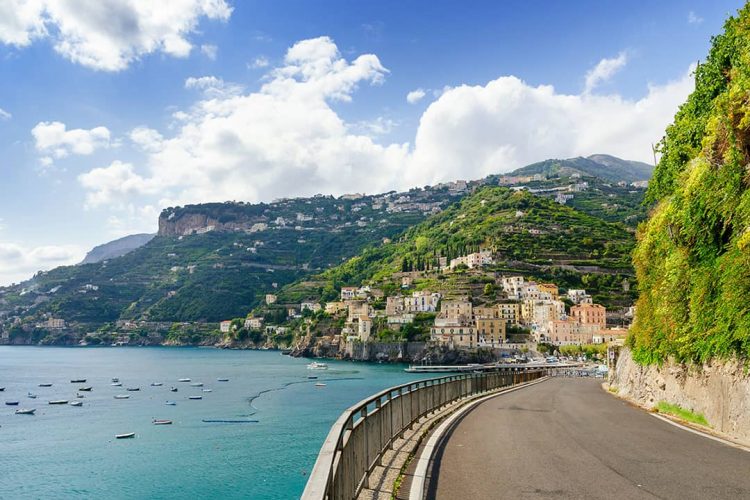 Positano, Amalfi Coast, Italy, road to Positano, coastal drive, boats and buildings of the town