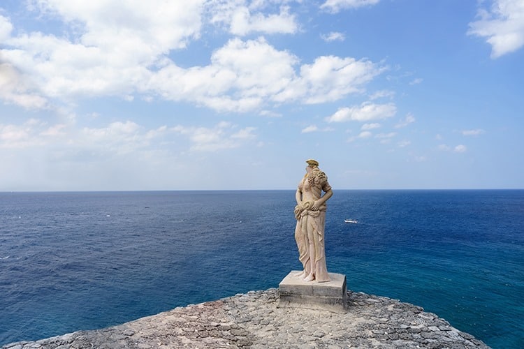 Grecian statue on cliff side in Fortune island