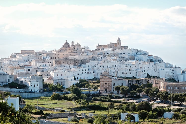 Ostuni Puglia Italy, white and cream colour buildings up on the hill