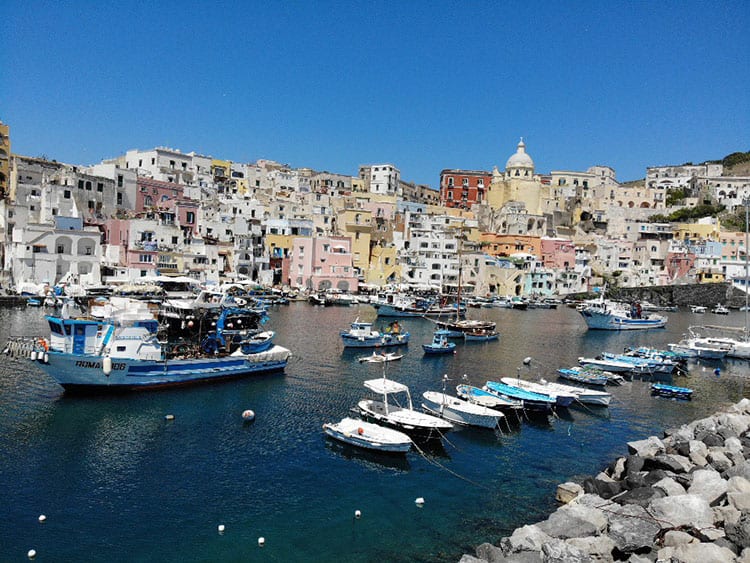 Marina Corricella, Procida in Italy, fishing boats and the colourful buildings in the back
