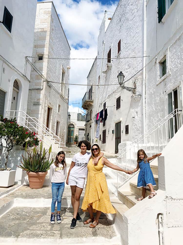 Ostuni Old Town Puglia, Italy, mother and daughters, family, in the alley