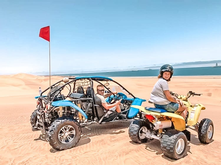 Daredevil Adventure with Kids in Swakopmund - Father sitting in the Dune Buggy and daughter on the quad in Namibia