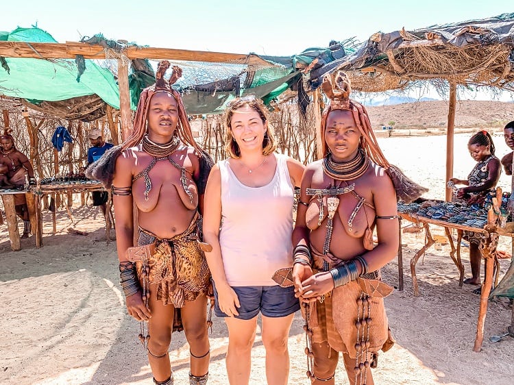 Meeting with the Himba Tribe Namibia, woman posing with two local women