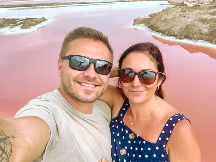 Visit the Salt Lakes with Kids in Swakopmund, Namibia, A couple doing a selfie with pink lake in background
